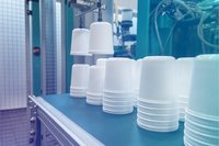 An injection moulding machine makes plastic boxes Removal of items from the plastic injection moulding machine